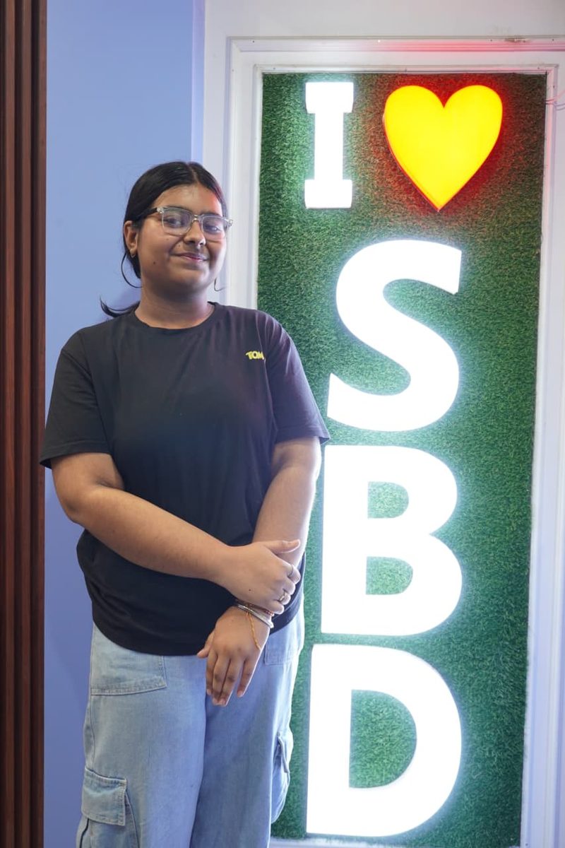 Student at the I love SBD wall