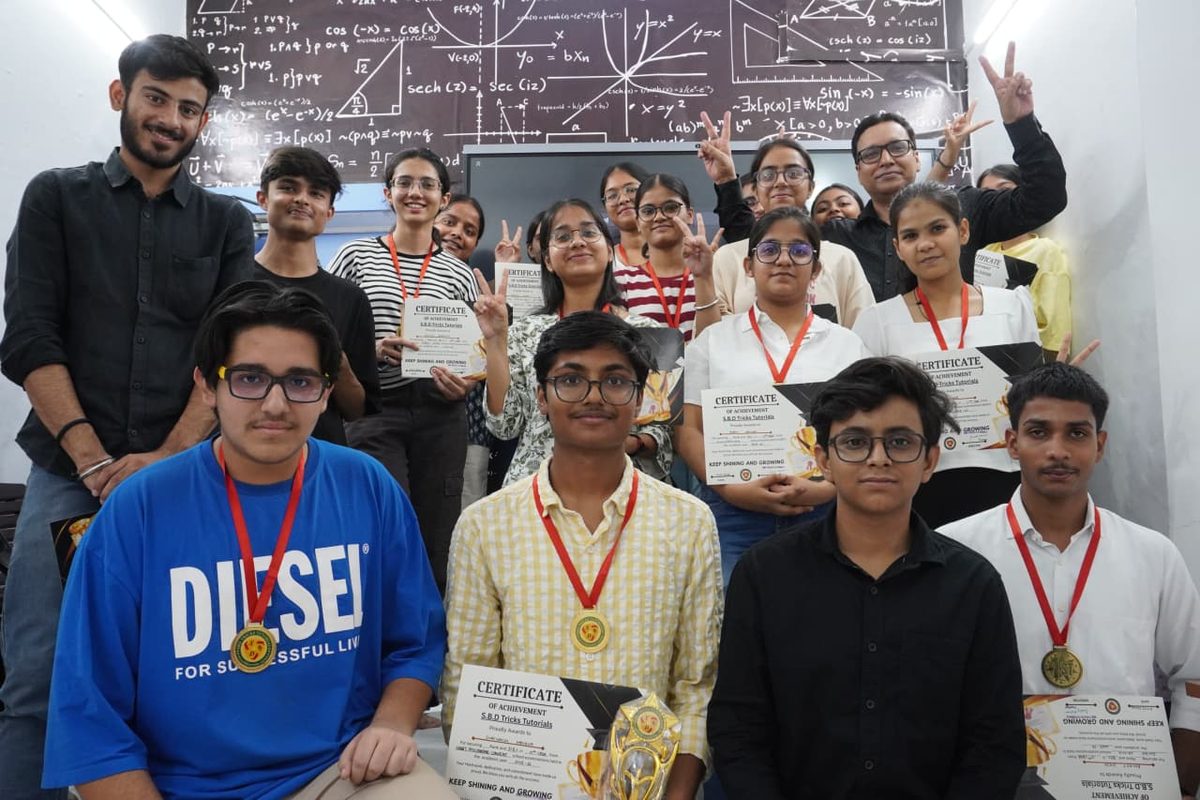 Students with their achievement certificates and medals